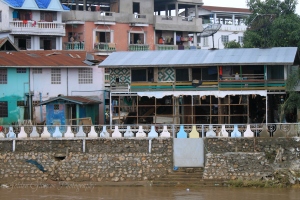 The view across the river at Burma. Note the entire wall that is missing from one of the buildings due to the flood.